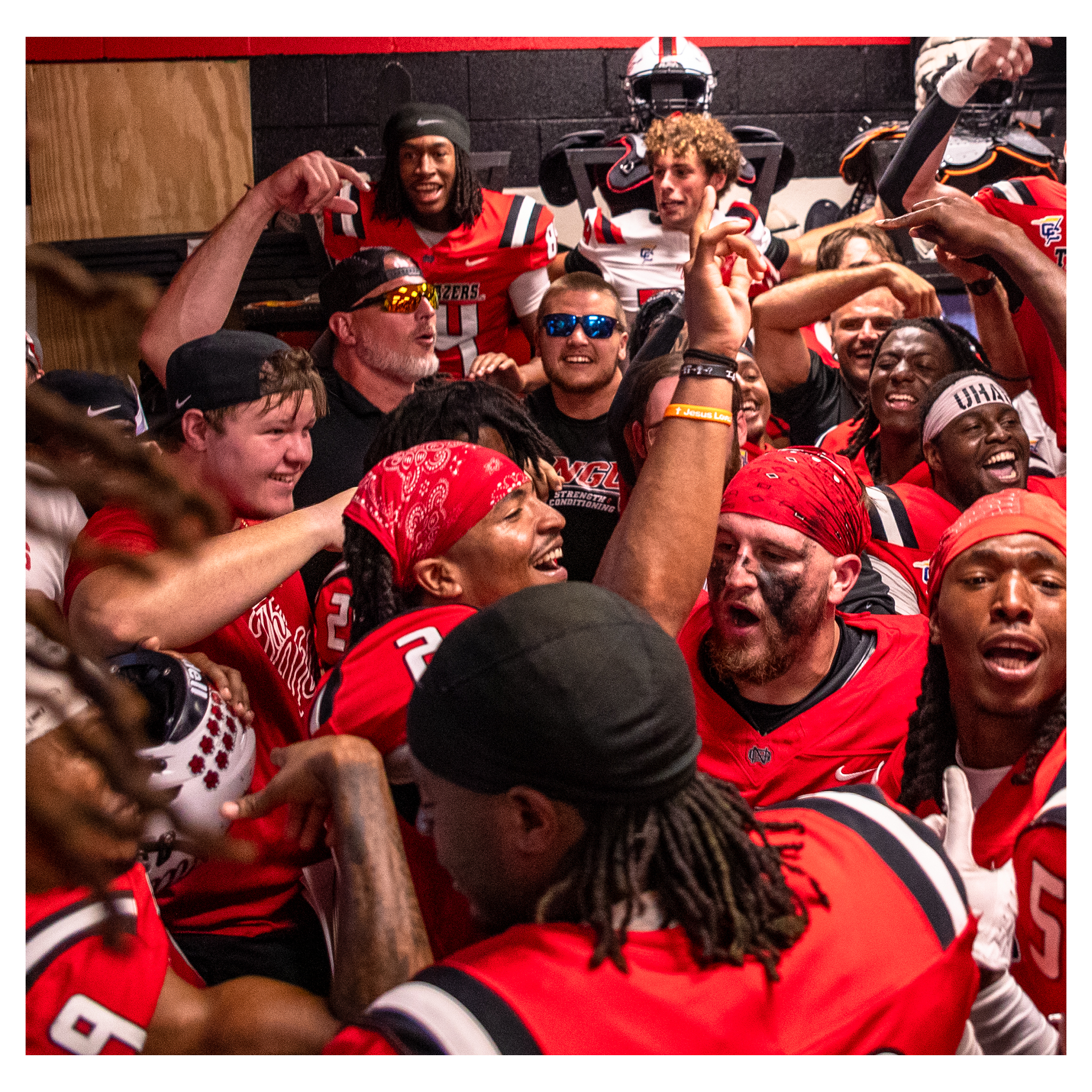 North Greenville football team celebrating in the locker room