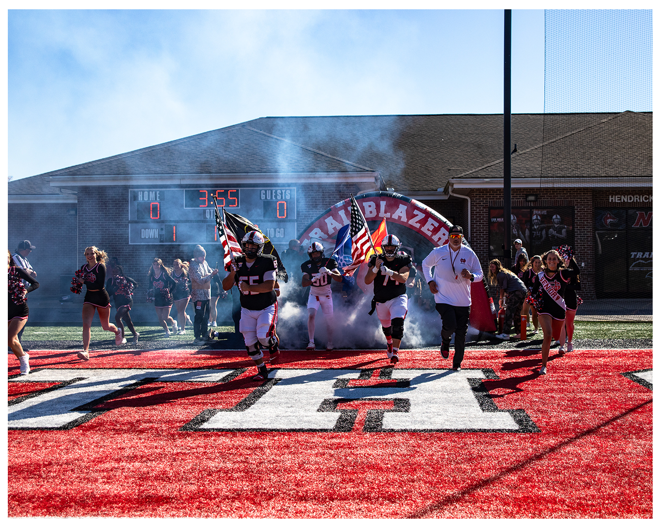 North Greenville University football team running onto the field