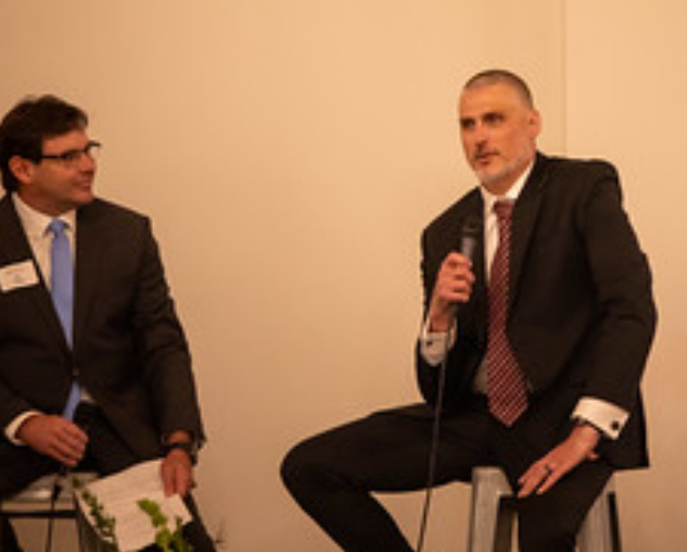 Nate Garner speaking at an event with microphone